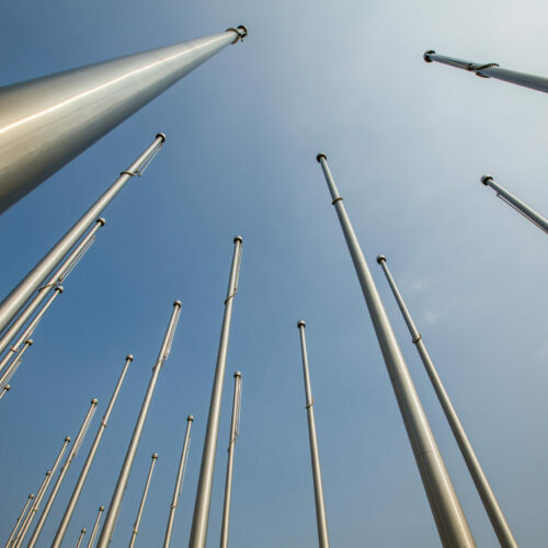 Row,Of,Flagpole,In,Empty,Square,tianjin,china.